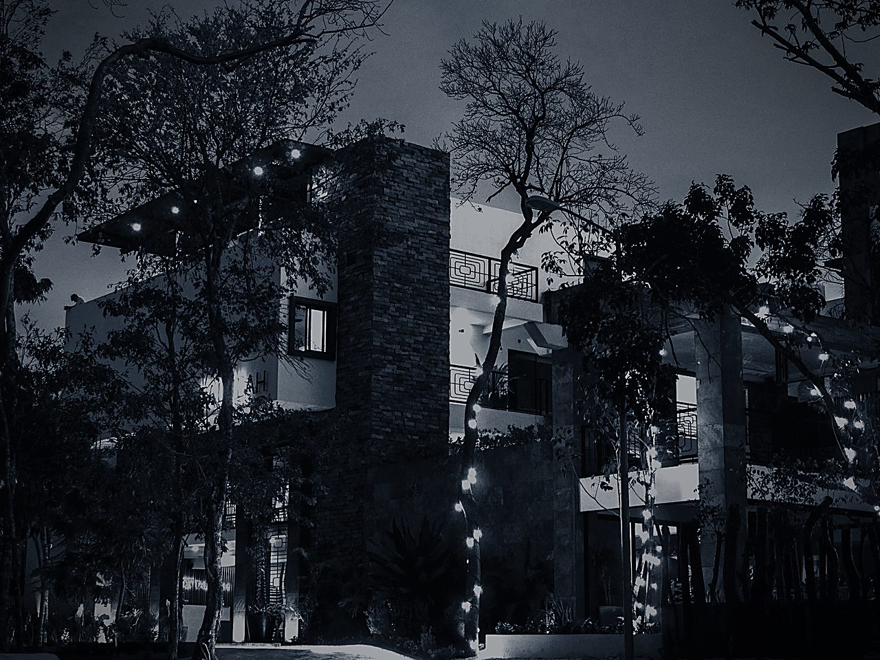 Hotel building exterior lit at dusk